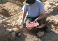 Dan Lamp cleaning walls before he draws them in Panayia Field in 2006.