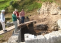 Charles Williams explaining scarp stratigraphy to Evelyn Adkins, Emilia Oddo and Nancy Bookidis.