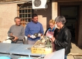 ASCSA staff discuss the conservation and reorganization of a group of bronze artifacts.